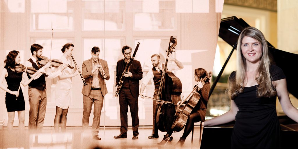 A group of seven musicians performing with violins, clarinet, trumpet, bassoon, double bass, and cello, alongside a woman standing beside a grand piano, smiling